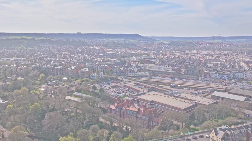 Scarborough Railway Station Westborough Scarborough North Yorkshire Yorkshire and the Humber England United Kingdom with rail terminus platforms and surrounding town centre, drone ascent shot