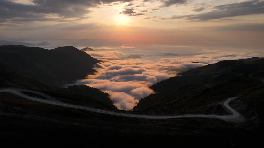 Footage of the mountaintops, of beams of light filtering through the clouds, the sunset, and a sea of mist amidst the forests.