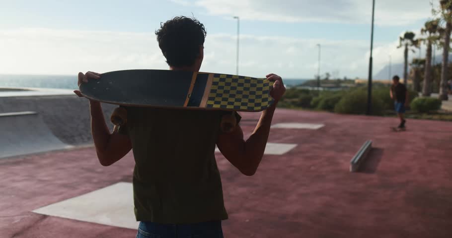 Young people having fun at skateboard park outdoor during sunset time - Summer lifestyle, skater boys and extreme sport concept