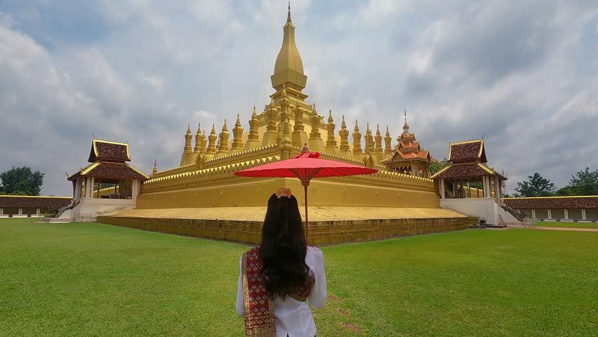 Asian woman wearing laos traditional at Phra that luang in Vientiane, Laos.