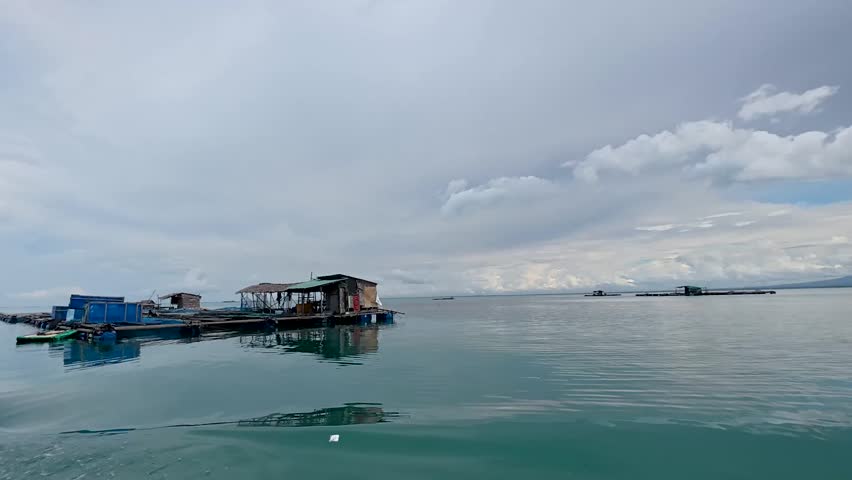 view of an island and fish farming in the open sea waters