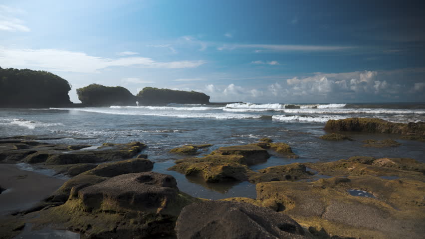 Rocky Tropical Beach with Tide Pools and Ocean Waves