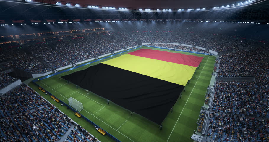 Professional Stadium With Soccer Game Championship With Flag of Belgium Spread Across Pitch Before Football Match Start. Cheering Crowds of Fans Fill the Arena in Excitement. Aerial Static Shot