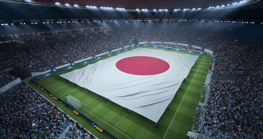 Professional Stadium With Soccer Game Championship With Flag of Japan Spread Across Pitch Before Football Match Start. Cheering Crowds of Fans at Arena Anthem Ceremony. Aerial Static Wide Shot