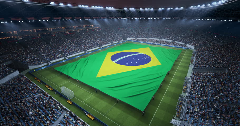 Professional Stadium With Soccer Game Championship With Flag of Brazil Spread Across Pitch Before Football Match Start. Cheering Crowds of Fans at Arena Anthem Ceremony. Aerial Static Shot