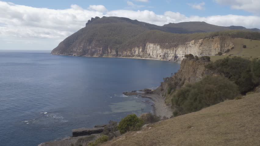 Rugged Coastline Of Maria Island With View Of The Fossil Cliffs In Tasmania, Australia. wide shot