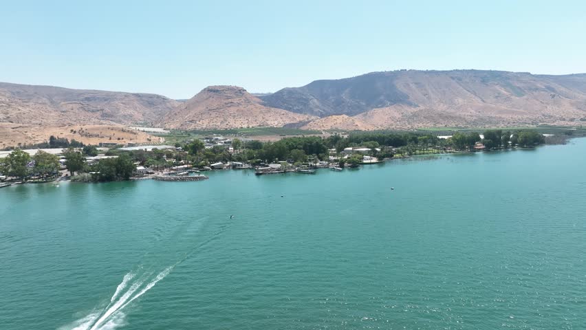 Aerial Panorama of the Sea of Galilee (Kinneret) Shoreline Featuring Resorts, Green Water, and Arid Mountains