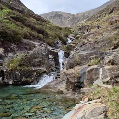 Beautiful waterfalls in Wales forest, lush green nature landscape