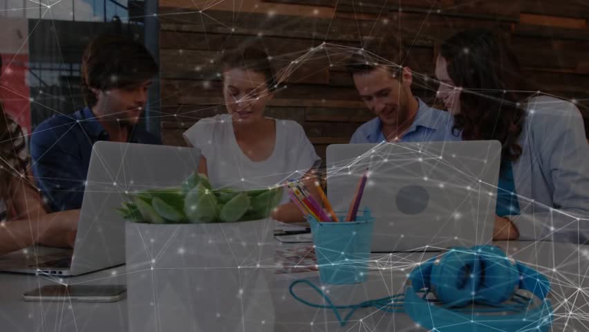 Striped woman tapping laptop, starting biz planning, team leaning, network overlay linking laptops. Coworking, collaboration, brainstorming, startup, productivity, discussion, modern