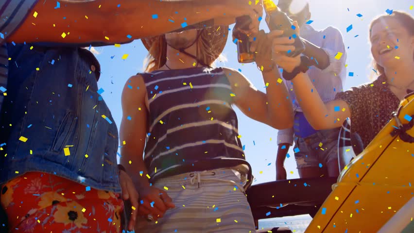 Group reaching bottles, sparking confetti, straw-hat man drinking, celebrating boat leisure. Celebration, toast, vibrant, summer, friends, sunglasses, hat
