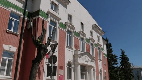 Aerial Rotation around Old Building Exterior Wall