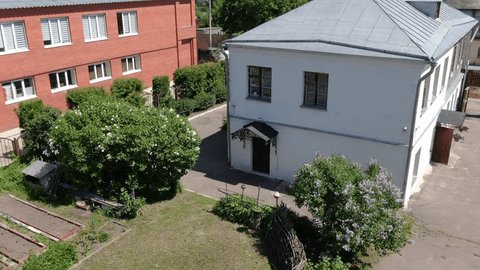 Drone Circling around Historic Style House Exterior
