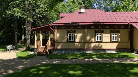Low Drone Flight Past Traditional Log House