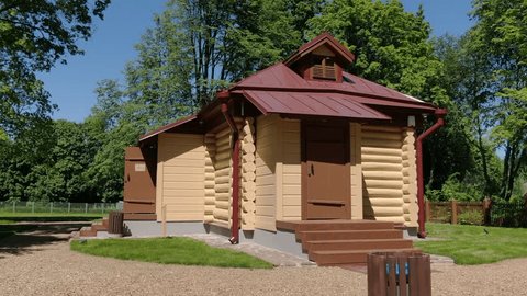 Drone Flying around Wooden House Park Setting