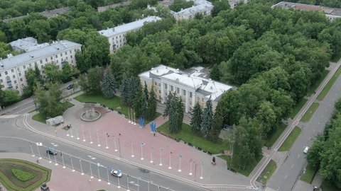 Drone Descending over City Square Fountain
