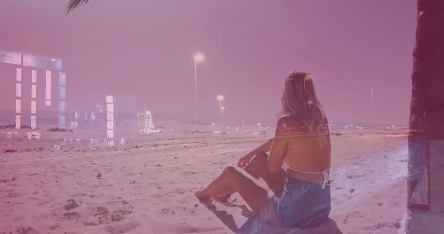 Adult woman sitting shore night, shifting, lifting phone, marketing HUD crossing over her to lamps. Beach, cityscape, dusk, palm, doubleexposure, overlay, horizon