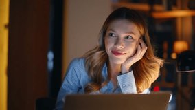 Executive drinking coffee late evening looking laptop glowing screen closeup. Smiling relaxed businesswoman working night sipping beverage. Elegant professional programmer thinking task in dark office - Powered by Shutterstock - Get 15% off with code: PIKWIZARD15