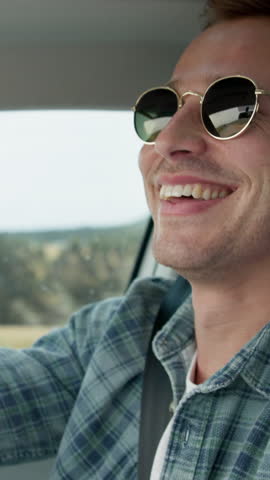 Man, happiness and drive for travel with talking, road trip or getaway in car for countryside vacation. Person, traveler or smile for holiday, transportation and driver in funny conversation on break
