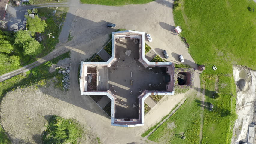 Rotating top view aerial shot of abandoned Yakkima kircha (church), nowadays City of Angels Museum. Lahdenpohja, Karelia, Russia.