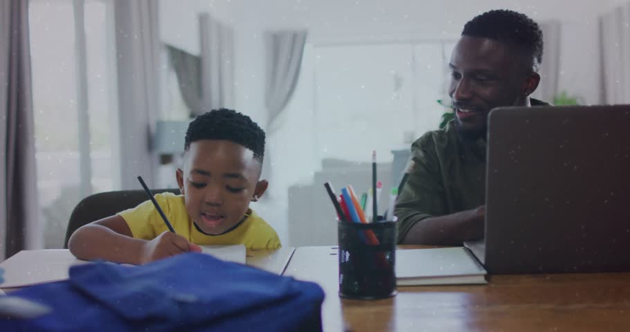 Son drawing at table, father watching laptop, bubbles rising from laptop, showing study distraction. Child, parent, learning, education, computer, workstation, home