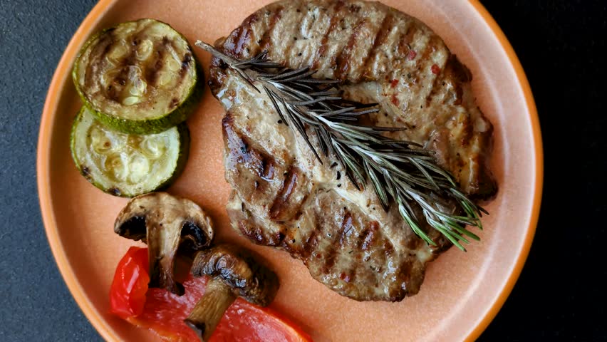 Grilled beef or pork steak, healthy restaurant food for lunch. Barbecue steak as a food background for your design