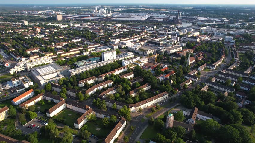 Aerial panorama view beside the downtown of the city Wolfsburg in Germany on a sunny morning in summer.