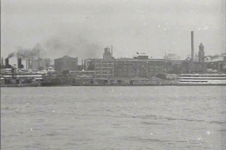 1910s, 1920s - Panorama of a harbor and city skyline