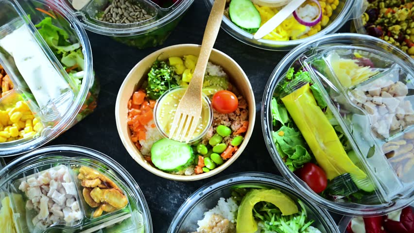 Plastic boxes with pre-packaged vegetable salads. Convenience food
