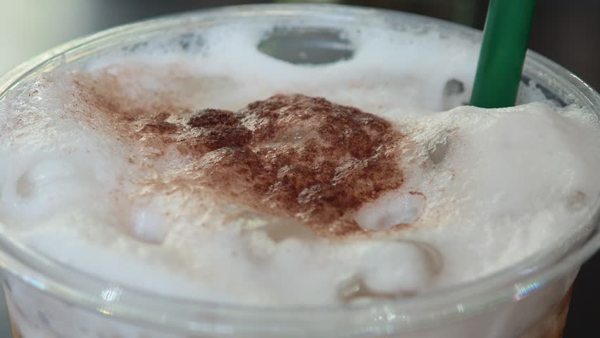 Freshly brewed cappuccino in a mug.