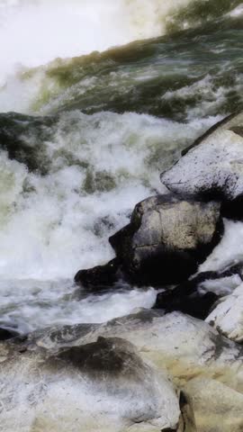 slow motion waterfall running through rocks
