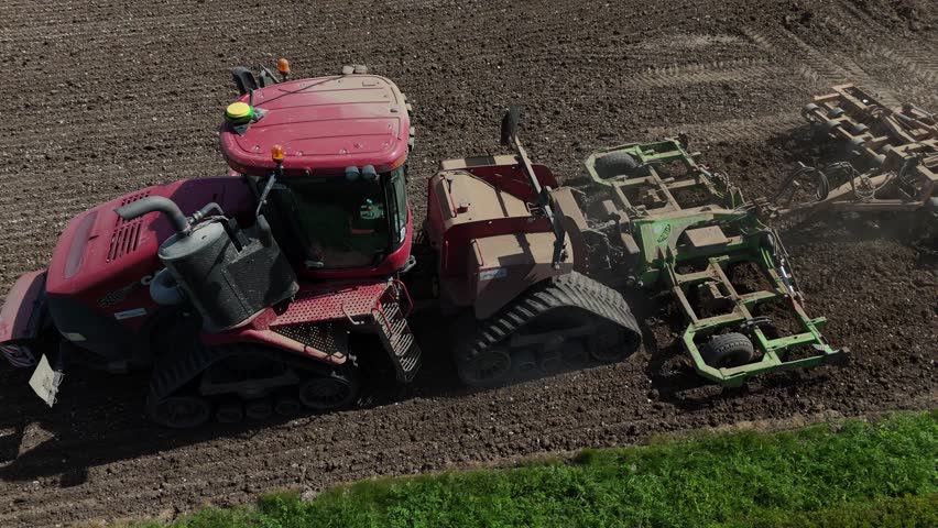 Farming machinery plough close up from above tractor potato crop planting