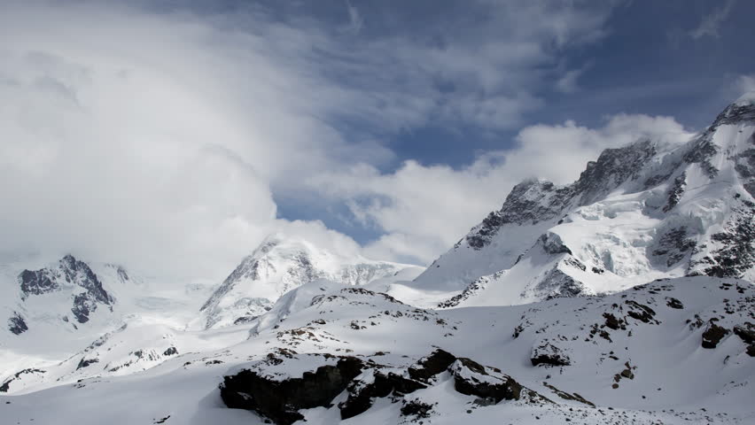 amazing alps mountain timelapse with passing clouds