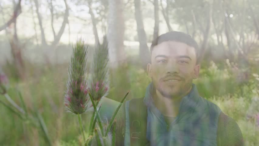 Pullback revealing trail sending two hikers with packs helping, flower overlay guiding outdoor trek. Forest, meadow, sunlight, companionship, nature, walk, dreamlike