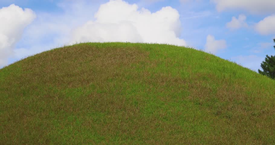 Daereungwon Tomb Complex in a sunny day, Gyeongju, South Korea, tumulus royal imperial Silla dynasty tombs, mound grassy green hill, North Gyeongsang Province, Gyeongju city view, Yeongnam region