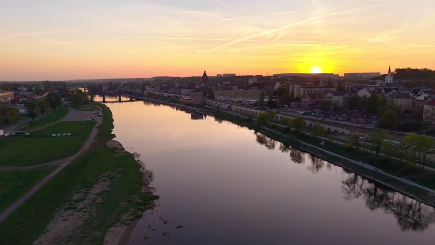 Fly over sunset view of Warta riverside and city center of Gorzów Wielkopolski. Poland