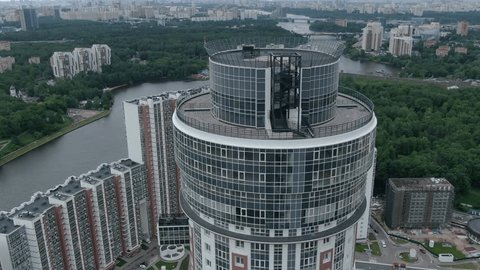 Aerial View Drone Flying above Round Skyscraper