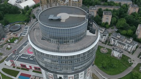 Drone Circling around Modern Round Skyscraper Complex