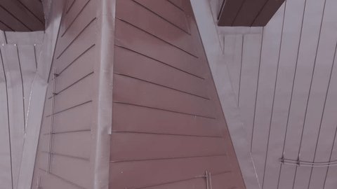 Drone Pulling Back over Rooftop Old Building