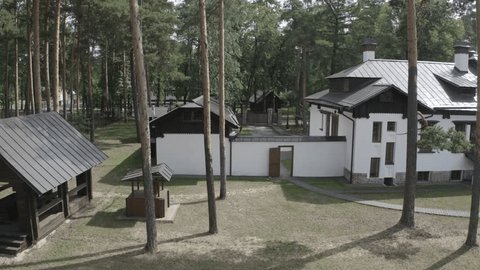 Drone Flying Sideways along House Forest
