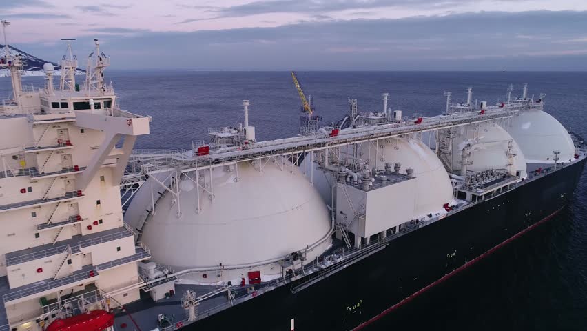 Aerial of Liquified Natural Gas LNG carrier moored to a small gas terminal. Fuel crisis. Sanctions
