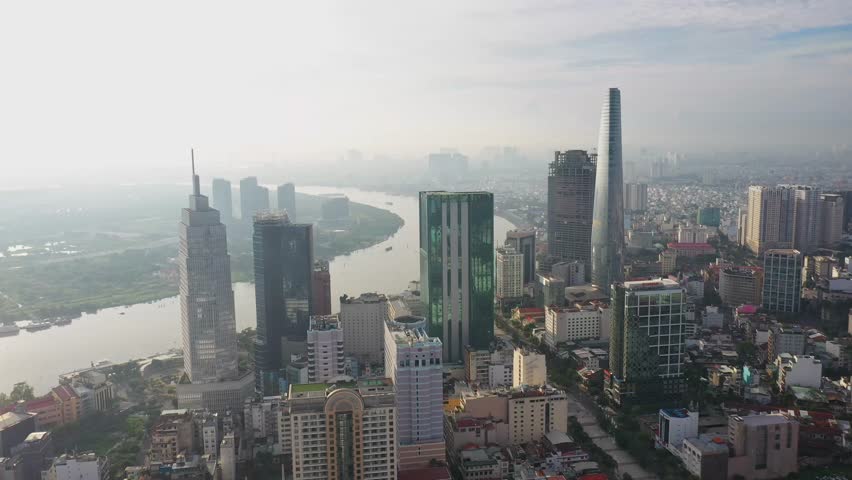 Drone aerial of Ho Chi Minh City skyline and Saigon River, Bitexco Tower, Vietnam Cityscape