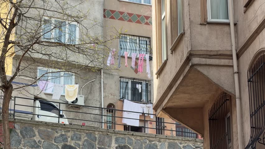 Quiet Afternoon in Istanbul: Residential Buildings and Laundry Against a Clear Sky
