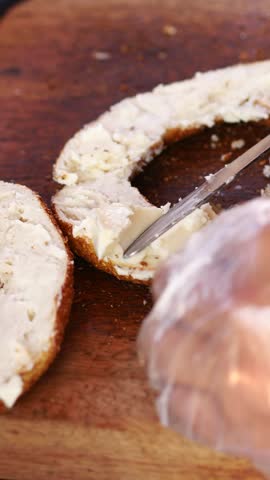 Making a delicious bagel with cream cheese spread