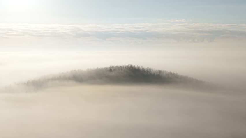 Minimal scenic view of hill in morning mist