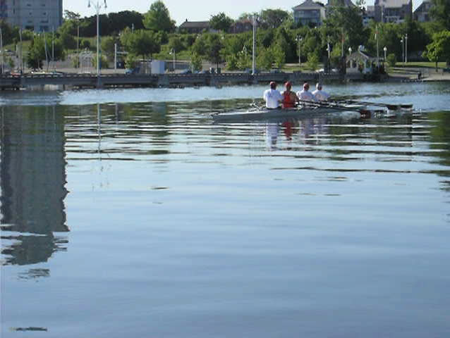Early morning training of the man team on a rowing boat.