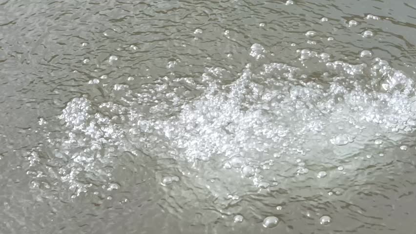 Water Fountain Bubbles in Pond with Splashing Flow and Refreshing Outdoor Scene