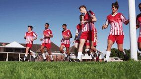Teen soccer team jogging pitch, shifting into crouch with blue HUD appearing sparking sprint drill. Athletes, stock, vibrant, sports, outdoors, field, uniforms - Powered by Shutterstock - Get 15% off with code: PIKWIZARD15