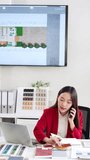 young interior designer woman sitting at table with blueprint drawing ,swatches and material , discussing interior design with client by phone, choosing materials for decorations. - Powered by Shutterstock - Get 15% off with code: PIKWIZARD15