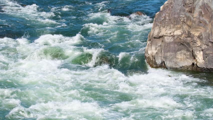 View of the powerful rushing water and white rapids of the Potomac River at Great Falls Park in McLean, Virginia, United States.