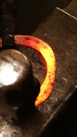 Blacksmith working on a horseshoe in workshop 4k